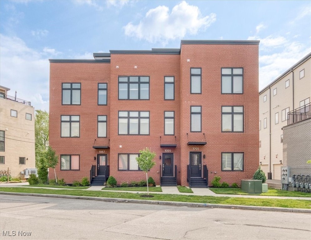 Step into luxury living with this new 2-bedroom, 2 full + 2 half bath townhome in one of Cleveland?s most vibrant neighborhoods, Ohio City. Surrounded by restaurants, boutiques, and entertainment all within steps of the unit, you will never be bored!
Designed with modern style and high-end finishes throughout, this home features a gourmet chef?s kitchen complete with soft-close cabinetry, stone countertops, a custom tile backsplash, and premium KitchenAid appliances?including a vented hood, microwave drawer, and dishwasher.
Soaring energy efficient windows bathe the open-concept living area in natural light, complemented by plank flooring and a cozy electric fireplace?perfect for both everyday living and entertaining.
Enjoy ultimate privacy upstairs with two spacious bedrooms, laundry area, walk-in closets, and a luxe primary suite featuring a tiled shower, quartz counters, and designer flooring. Need a home office or bonus space? The first-floor flex room with a half bath is ideal.
Take in breathtaking city views and lake sunsets from your private 420 sq ft rooftop deck and enjoy the convenience of an attached 2-car garage. Built for efficiency and sustainability, this home is 100% Energy Star Rated and includes a tankless water heater. 13 years of tax abatement left on this incredible opportunity.