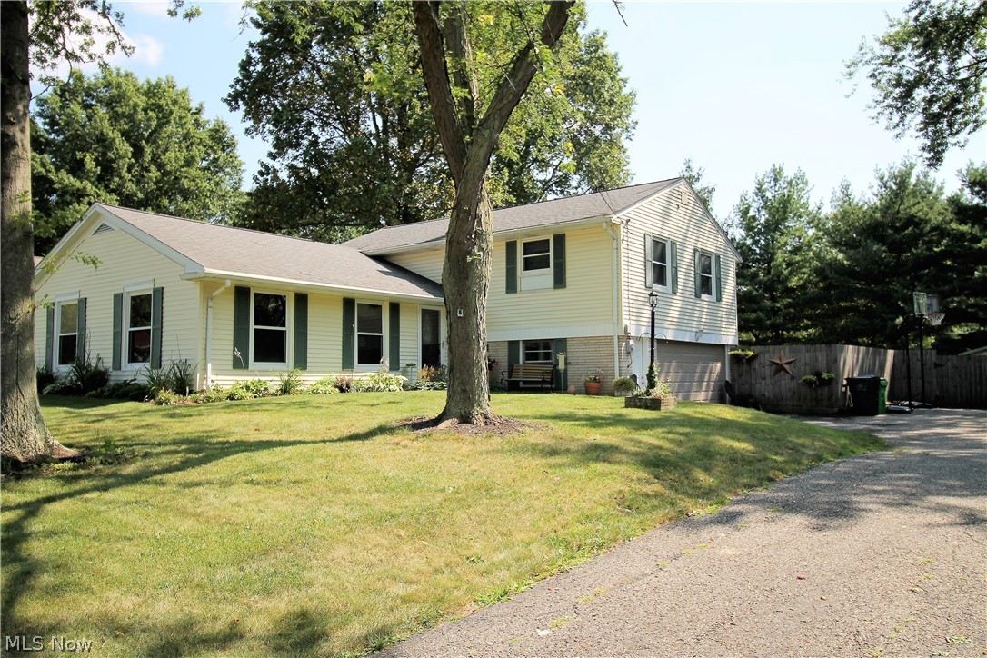 Precious memories begin right here in this stunning updated four bedroom, two and half bath, split level home that radiates with pride and love. Come inside to the open front entry which has new light fixtures and tile flooring (2017) and leads to the living room, kitchen, lower level or upstairs. The living room boasts three spectacular windows, which offer natural sunlight to shine through. The first floor flows seamlessly from the living room to the gorgeous dining room to the modern kitchen. The kitchen offers abundant cabinets, has recently been painted in 2019, stainless steel appliances, including a wall oven, and there is room enough for a table to enjoy your morning coffee. The upstairs offers four large bedrooms and updated bathrooms. The large master bedroom has double closets. The lower level has a finished family room with sliding door leading to the large fenced in backyard, concrete patio for entertaining and a storage shed, for all the finest outdoor living! There is a