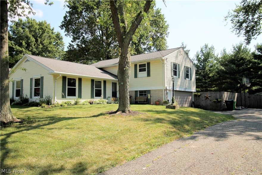 Precious memories begin right here in this stunning updated four bedroom, two and half bath, split level home that radiates with pride and love. Come inside to the open front entry which has new light fixtures and tile flooring (2017) and leads to the living room, kitchen, lower level or upstairs. The living room boasts three spectacular windows, which offer natural sunlight to shine through. The first floor flows seamlessly from the living room to the gorgeous dining room to the modern kitchen.  The kitchen offers abundant cabinets, has recently been painted in 2019, stainless steel appliances, including a wall oven, and there is room enough for a table to enjoy your morning coffee. The upstairs offers four large bedrooms and updated bathrooms. The large master bedroom has double closets. The lower level has a finished family room with sliding door leading to the large fenced in backyard, concrete patio for entertaining and a storage shed, for all the finest outdoor living! There is a