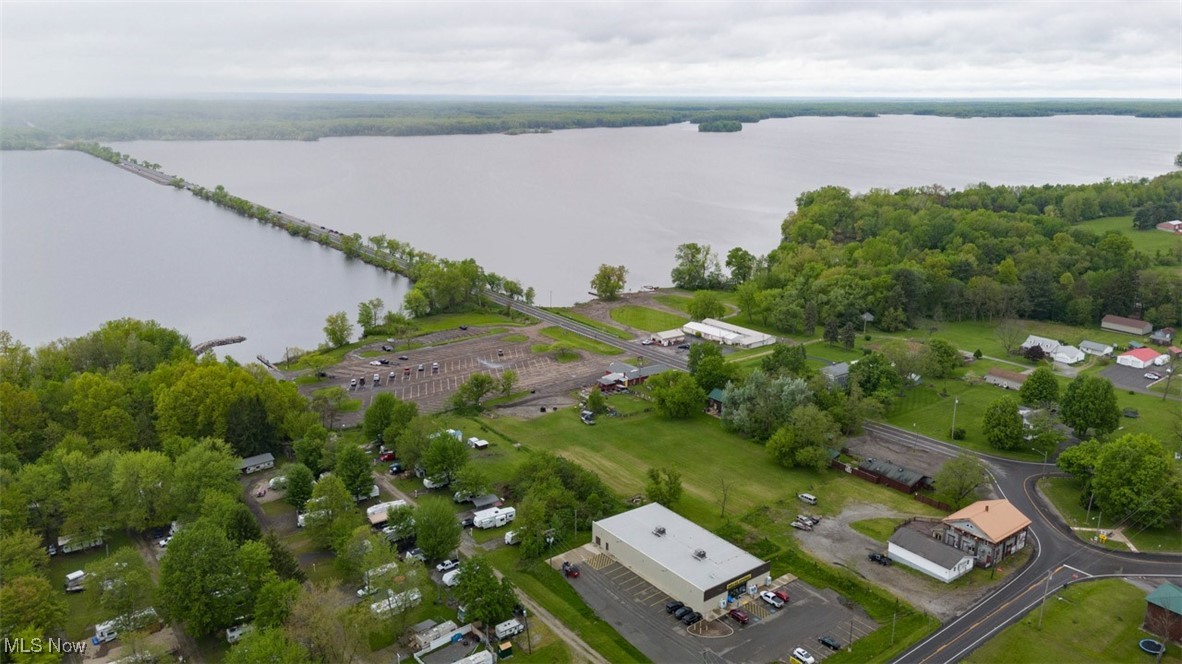 Mosquito Lake Area, Turnkey Opportunity. Yellow Dog Saloon & Grill, D6 7-Day Liquor License, Outdoor Patio/Bar, Full Kitchen with Bar & Dining Room. Located Near Boat Ramp & Causeway. Live Onsite with Online Bidding Available. ABSOLUTE AUCTION, all sells to the highest bidder on location. ONLINE AND LIVE ON-SITE BIDDING WILL BEGIN THURSDAY, JUNE 12, 2025, 12:00 PM.
Real estate features a 2,900+ sq. ft. building. Large bar area with dining room and billiard area. Seating for approx. 40, bar equipped with 6 keg tap system, several coolers, triple bay bar sink, TVs, multi-flow soft drink system. Full kitchen with griddle, flattop, fryer, hood, and Ansil system, several commercial coolers and freezers. Two restrooms. Partial basement with storage and utility area. Bar was added on to in 2000 with a block foundation and basement. Replacement windows 5 years ago, new roof and doors last year. FA gas heat and central air. Commercial licensed septic system, private well. Outdoor bar/patio has full bar and seating area under roof, 14 stools, several coolers, covered area for cooking with grills and smokers. Large open patio and yard. All designated areas. Electric and water hookups for food trucks. The patio is ideal for bands, bike nights, etc. NOTE. All kitchen and bar equipment transfer. Inventory will transfer at cost. This establishment is open 7 days a week and can transfer turnkey. Nice location. The property will be open at 10:00 AM on auction day to register.