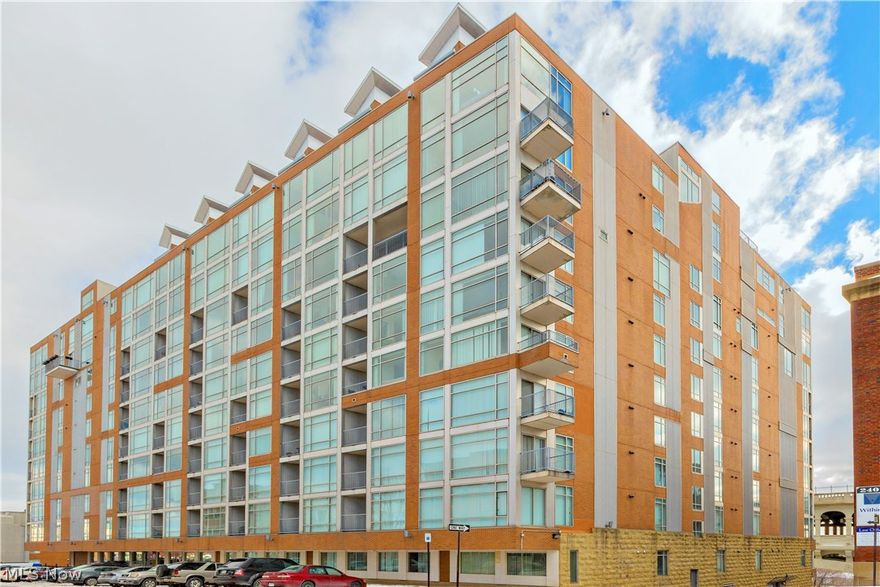 Welcome to this exceptional 2 Bedroom 2 Full Bath corner unit in Stonebridge Towers with outstanding panoramic views of Veterans Memorial Bridge, tree-lined river, and city. The generously sized open kitchen is complete with S.S. appliances including a gas range, granite counters and large peninsula for casual dining. The living room feature full walls of floor to ceiling windows and a three-sided gas fireplace. Cozy up by the fire in the winter while still enjoying the city view or step out onto the balcony for some fresh air in the summer and taking in the Cleveland skyline. The spacious master suite includes a large master bathroom complete with walk-in shower tiled floor to ceiling with granite. There is an additional guest bedroom and full guest bath also all granite. This condo offers in-suite washer/dryer and the building includes a fitness center and 24hr security/concierge. The best part is the location, situated right on Cleveland's Flats west bank and minutes from Ohio City,