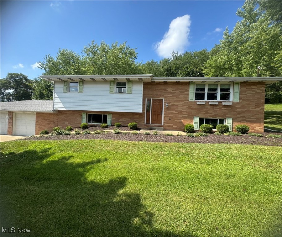This charming three bedroom split level home features a sturdy brick exterior, offering both aesthetics and durability sitting on 1.2 acres with a three car attached garage. As you enter, a welcoming foyer leads to the main living area. This space is designed for comfort and relaxation, with large windows allowing abundant natural light. The living room connects seamlessly to the dining area, ideal for family meals and entertaining guests. Primary bedroom with an En Suite for added privacy and convenience. The home's split-level design allows for separate zones, with a cozy family room on a lower level, providing a great space for recreation. The half bath located in the basement adds convenience and accessibility, especially while entertaining. With some updates, this home can truly shine, combining modern living with classic features in a desirable setting. Enjoy the space, functionality, and potential this home has to offer! Call for your Private Showing Today!!!