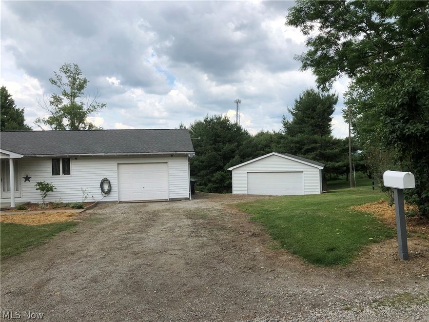 Wonderful updated ranch home in a county setting on just over an acre.  Just minutes from I70.   Completely remodeled!   All new flooring, new dimensional roof (2 years old), new furnace and central air (1 year old), new dishwasher, new refrigerator and newer stove, new disposal, new well pressure tank, well pump 2 years old, updated baths, freshly painted and more.  Custom kitchen cabinets with large pantry, desk area, waste compactor and island with chef sink. Custom kitchen light and built in glass shelves in dining area.  Master bedroom has built in makeup vanity and sink. Three master bedroom closets - the walk in is 8 x 6.  Bedrooms are separated in the home for privacy.   Full basement with very tall ceilings, partitioned and ready to finish.  16 x 6 cover front porch.   Just over one acre with an attached 26 x 14 garage and an additional 26 x 24 detached garage.  Large commercial bank safe & desk comes with the home.  Contractor built, one family owner, well cared for home!   M