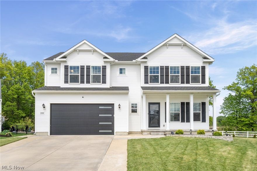 Built in 2022, this exceptional 5-bedroom, 3 full bath home offers over 4,000 square feet of beautifully finished living space with thoughtful upgrades throughout. Situated on a premium lot with no rear neighbors and unobstructed views, the setting offers a rare sense of privacy and openness that is hard to find in newer developments. The homesites in this section are more generously spaced, creating a noticeably less crowded feel.  Inside, the home showcases an open-concept layout designed for both everyday living and entertaining. From the moment you enter, the elevated finishes and custom selections make it clear this is far from a typical builder-grade home. The spacious kitchen with 9.5' quartz island flows seamlessly into the main living areas, while large windows bring in natural light and highlight the peaceful views beyond. The finished lower level expands the home’s versatility with impressive 9-foot ceilings, abundant additional living space, and a rough-in for a future full bath—perfect for a guest suite, recreation area, home gym, or media room. With modern construction, upgraded features, and a premium homesite, this move-in ready home combines the benefits of new construction without the wait.  Additional upgrades beyond initial construction include but are not limited to: whole home reverse osmosis system (2025), front and side landscaping (2025), kitchen backsplash and range hood vented outside (2025), garage door (2025), EV/Tesla Charger (2025), Water Softener System (2025), Storm Doors (2023), Upgraded sump pump to cast iron (2023).