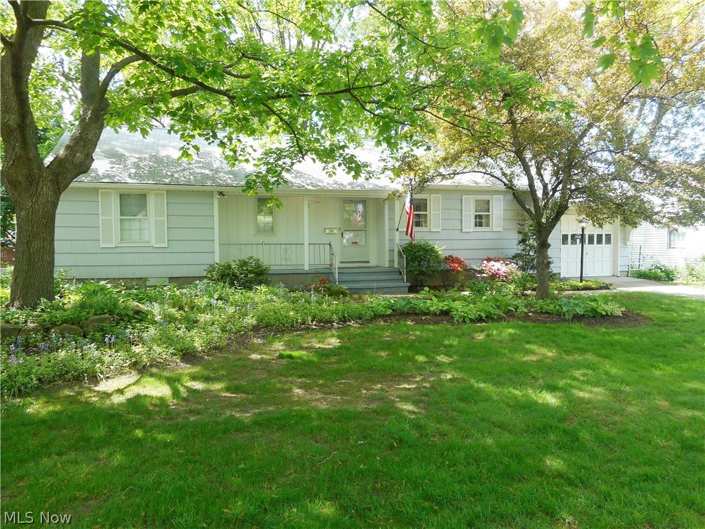 Rare opportunity for one floor living. This lovely 3 bedroom, 2 full bath Ranch home is situated further back from the street. The large front yard and front porch welcome you as you enter the living room accented by a wood burning fireplace, built-in shelves and a large picture window with views of the fenced backyard. There are hardwood floors under the living room, dining room, hallway and bedroom carpeting. In addition to the living room fireplace the lower level is finished and also offers a fireplace, as well as a full bath with walk-in shower. A back porch, shed, alarm system and a newer furnace (2005) are added bonuses. Don't wait, call to see this home today!