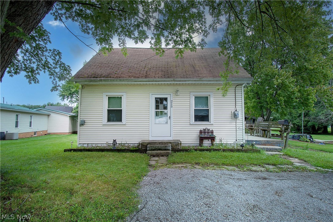 Welcome to 215 28th St. SW, Canton, great for first-time home buyers. Enter the living room with original hardwood flooring, ceiling fan, and freshly painted walls and feel at home. The kitchen is spacious and offers stainless steel refrigerator & stove, newly painted cabinets, a pantry, built-in shelves, a dinette area, and access to a side porch to put a grill and a few chairs and enjoy and relax. A convenient first-floor bedroom and full bathroom (with shower/tub combo & linen storage) complete the main floor. The upstairs has two bedrooms with ceiling fans and plenty of storage space. The full basement has glass blocks, windows, and a utility sink—a nice backyard with a large shed (12x15) for extra storage—convenient to groceries stores, gas stations, and easy highway access. Book your private showing today!