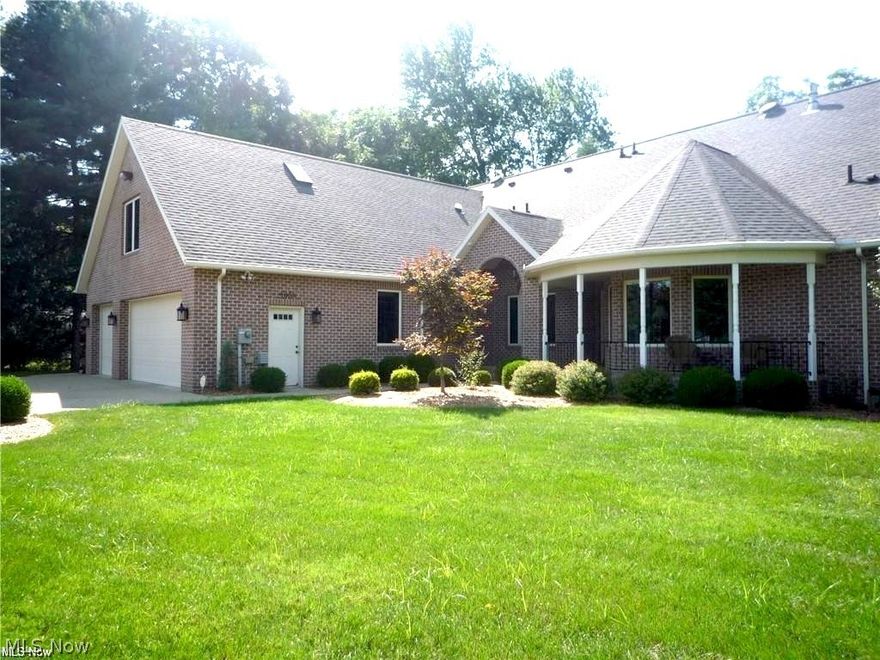 River Road Vienna! This exceptional custom one-owner home, built by Rick Webb, is perfectly situated on a ¾-acre lot overlooking both the golf course and the Ohio River. 3(4) BR, 3 BA with 2956 sqft of First floor Living & 2000 sqft lower level, w/ a total of 4956 sqft of living space (per auditor)! Drive your golf cart straight to the Country Club! Quality craftsmanship shines throughout this all-brick residence featuring 10' ceilings, solid wood panel doors, and hardwood floors. The open-concept layout includes a gourmet kitchen with maple cabinetry, granite countertops, stainless steel appliances, under-cabinet lighting, a breakfast bar, and an island with prep sink. A spacious walk-in pantry provides abundant storage. The owner's suite measures an impressive 17x23 and offers a vaulted ceiling and patio doors opening to the screened porch. The luxurious en-suite bath includes a large walk-in shower with 3 spray heads, dual-sink granite vanity, and dedicated makeup bench. The 10x16 walk-in closet features built-in cabinetry and connects conveniently to the laundry room. Enjoy true one floor living with numerous high-end amenities: birds-eye maple built-ins in the great room, a 10x70 screened covered porch facing the golf course, a butler’s pantry w/ wine cooler, custom remote-control blinds, central vacuum, Kinetico water softener w/ reverse osmosis system, and a 20kW Generac generator. Additional highlights include an outdoor sprinkler system, two water meters, and an oversized 3-car garage (28x33) with a semi-finished caretaker/in-law efficiency suite above. The finished basement features a 19x26 media room, a 23x36 game room, & a full bath. 1st fl office could be a 4th bedroom! Outdoors, enjoy a dedicated potting room for gardening enthusiasts and a natural gas grill. Included with the home is a ¼ ownership interest in 14.25 acres of riverfront land, offering direct access to the Ohio River. See plat in the pictures.   All room measurements are approximate.