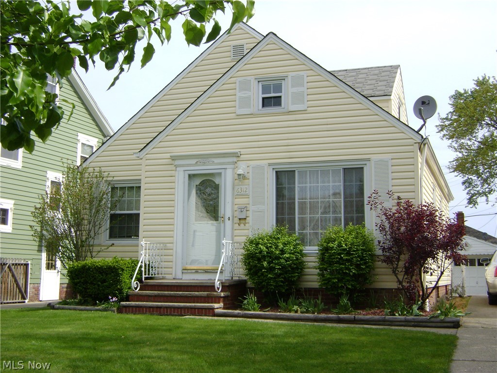 Hardwood flooring welcomes you into this updated classic cape cod with A/C. Natural light beams through the lovely leaded glass front door and through large living room windows. A bright eat-in kitchen featuring newer cabinets; dishwasher, stove, and 2 pantries. Hardwood flooring continues into 2 spacious, main floor bedrooms - one offering 2 closets. The expansive bedroom upstairs boasts 2 closets, extra space perfect for a reading nook, built-in shelves, ceiling fan, and additional window A/C. 3 attic access areas provide great storage. New entry door and new carpet complement the large, shaded sunroom which offers casual space and a great view to the partially shaded, fenced backyard and 1.5 car garage with garage door opener. The Waterproofed basement (with backwater valve) Rec room provides additional living space and features an additional toilet and shower room. Updated electrical panel. Fresh, neutral paint throughout. Ceiling fans, newer windows, newer roof and basement glass block windows provide security. Move-in ready home near shopping, schools, and amenities. Call today! Previously under contract...buyer failed to commit.