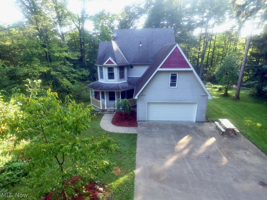 Charming 2 story home nestled in seclusion on 12 wooded acres.  This home has a large eat in kitchen, dining room and family room all with hardwood floors and a fireplace in the family room.  The main entrance is tiled with access to the attached 2 car garage, basement, second floor and first laundry.  There are three bedrooms on the second floor and two baths.  The master bedrooms has an attached master bath with his and hers sinks, tub, walk in shower and large walk in closet.  The fourth bedroom is in the basement.  The basement has been recently remodeled and features a second family room with wood stove hook up, full bath and bedroom with walk in closet.  All utilities are located in the basement. The following are all new furnace, hot water tank and Culligan water system. All of this sitting quietly inside this 12 acre parcel and accessed by a concrete driveway.