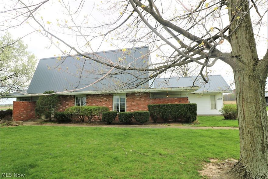 So much Character and Potential in this 3/4 bedroom, 2.5 bath country home sitting on a beautiful 6 acres with stocked pond and storm shelter!  This open floor plan includes a kitchen with large island and gorgeous brick fireplace. The first floor master suite boasts adjoining office and on-suite full bath. Other features include stained glass window, spacious rooms with lots of storage, additional 2 bedrooms and full bath upstairs, covered front patio, enclosed back porch, laundry chute, etc. The attached garage includes pull down attic storage, large closet, and toilet. The 28 x 48 pole barn has wood burner, propane furnace, water, and 14 x 48 lean to. Lots of room for entertaining inside or out...and don't forget about the great garden location! Entertainment center stays.