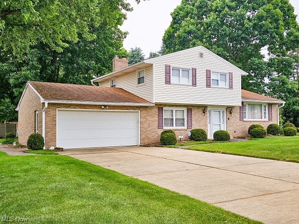 **Absolute Auction Wednesday – July 19, 2023 – 6:00 PM**Good looking brick and vinyl 3 bedroom, 1½ bath split level home in convenient Jackson Twp. location near schools, shopping and all amenities, features vinyl replacement windows, spacious foyer with guest closet, 3 bedrooms, 1½ baths, family room with gas log fireplace, carpeted living room, kitchen with built-in gas range with Rangaire hood, Kelvinator dishwasher, Amana refrigerator, and dining area, large master bath with tub / shower and half bath, 3 bedrooms having ceiling fans, lighted closets and hardwood floors, relaxing enclosed sunroom with wood floor, partially finished basement with F.A. gas furnace, central A/C, water conditioner and 100 amp breaker electric. 2-car attached garage and concrete driveway. All public utilities. Well treed and shrubbed half acre lot. Stark Co. parcel #1603614. Home open for preview 2 hours prior to auction.