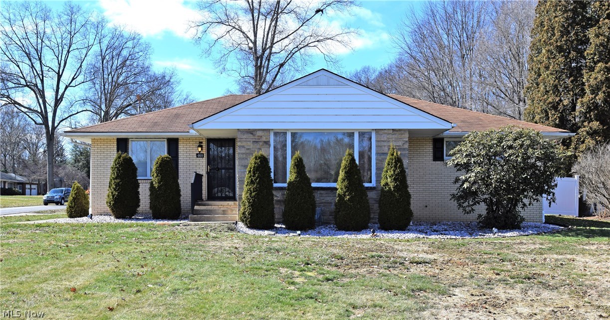 This gorgeous 3 bedroom 2.5 bathroom brick ranch has tons to offer! From recent remodeling to massive living space and hidden gems like a basement spa area; you won’t want to miss it. Warm, amber hardwood floors fill the halls and bedrooms of this home. Three ample bedrooms offer large closets and fresh ceiling fixtures. The centerpiece of the hall is a stunning updated bath in 2015 with dual vanity and glass tiled shower. A large carpeted living room boasts a huge front window and canister lighting 2016. The kitchen provides wrapping countertops and natural wood cabinetry with newer appliances staying along with a conjoined dining area. Nearby, a half bath and a finished mudroom with fireplace span both garage access and to the covered rear patio area where a fenced in backyard await. A large shed and stone firepit compliment the private yard. Downstairs a full basement offers a large finished rec area, laundry and workshop areas along with a wood paneled spa area and oversized bath.