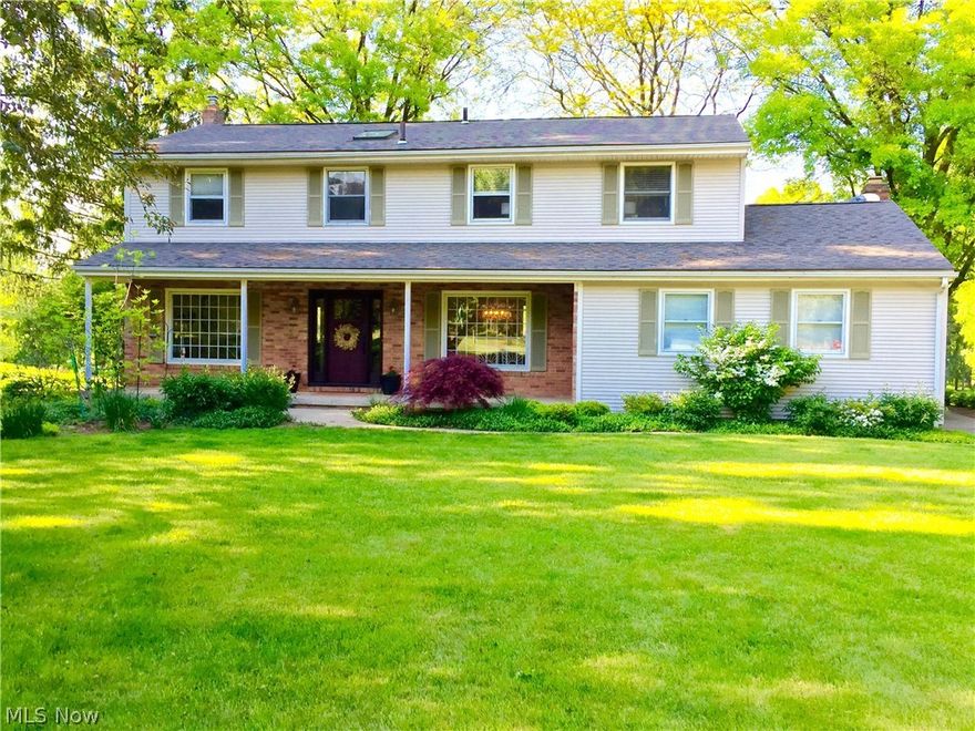 This updated colonial sits on over 2 acres with a park like setting and is move in ready! It boasts a sizeable kitchen complete with Schrock custom cabinets, granite countertops, stainless steel appliances, tile floors and windows overlooking the large backyard. It has both a light filled family room and den with hard floors and doors that lead onto the expansive deck. The den is highlighted by beautiful built in cabinets and a brick fireplace while the family room offers large windows with great views of the yard. The formal dining room has a big picture window and a beautiful glass tear drop chandiier. The first floor is completed by a half bath. The second floor has 4 bedrooms and 2 fully updated baths. The sizeable master bedroom suite includes a sitting room/office with a balcony that overlooks the park like setting. The master bath is completely updated with granite countertops, Schrock custom cabinets and a tiled shower/tub. The remaining three bedrooms have hardwood floors, ple