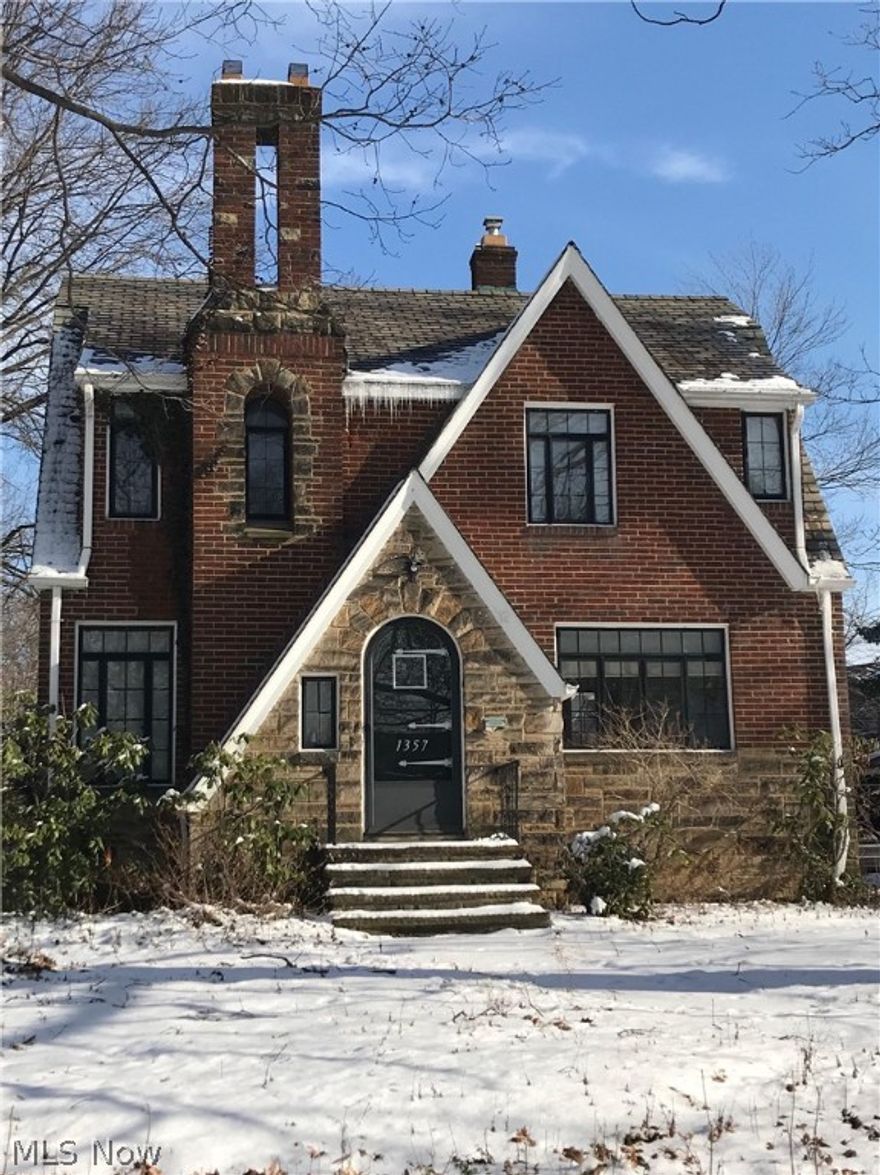 All brick colonial in beautiful Cleveland Heights. The home features an updated kitchen with granite counter tops and plenty of cabinets. Beautiful hardwood flooring throughout both floors. Living room with fireplace and custom built-in shelves. 3 bedrooms on 2nd floor with updated full bath. Finished recreation room, newer furnace and A/C. 2 car attached garage. Spacious back yard with deck.