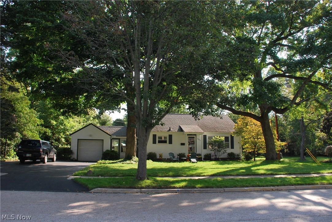 Wonderful 2 bedroom and 2 bathroom ranch with many updates including a finished basement level that offers a large family room and music room. Exceptional amount of storage and closets in this home. Dimensional shingled roof and vinyl siding with gorgeous landscape and large back yard that can be accessed from the side street. There is a yard barn tucked into the back corner of the lot and an awesome outdoor patio for dinners or relaxing! 1 car garage and blacktop driveway that was recently sealed. The breezeway is used as a 3-season room and leads into the kitchen or down into the basement level. New this year furnace and air conditioner! Kitchen was remodeled with hard surface countertop and tiled backsplash, all cabinets were painted white and chrome hardware installed for a fresh bright look. Kitchen has a real wood plank floating floor installed and bedrooms are the original hardwood. Mani floor full bath was updated with a full tub surround and shower walls by Bathfitters. Most o