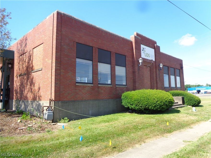 Flex space building offering many possibilities. Approximately 7300 square feet. Property remodeled 2005-2006. Fully handicapped accessible.  This hard to find building is ideally suited for small contractor, light assembly work, warehousing, retail, institution, office and more. The vacant lot to the west of the building is included in the sale. There is an easement on the property that prevents any permanent structure. However,  it does permit hard surface for additional parking. The rear space is heated and air conditioned. Open span space in the rear portion of the building.