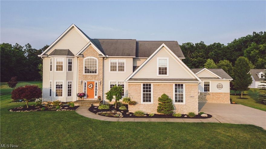 Custom built home with 1st floor in-law suite. All bedrooms have new carpet recently installed. This home has woods along the back of the property that buts up to a city park owned property. Enormous deck for viewing nature, or just relaxing. Basement is finished with full bath and bar.