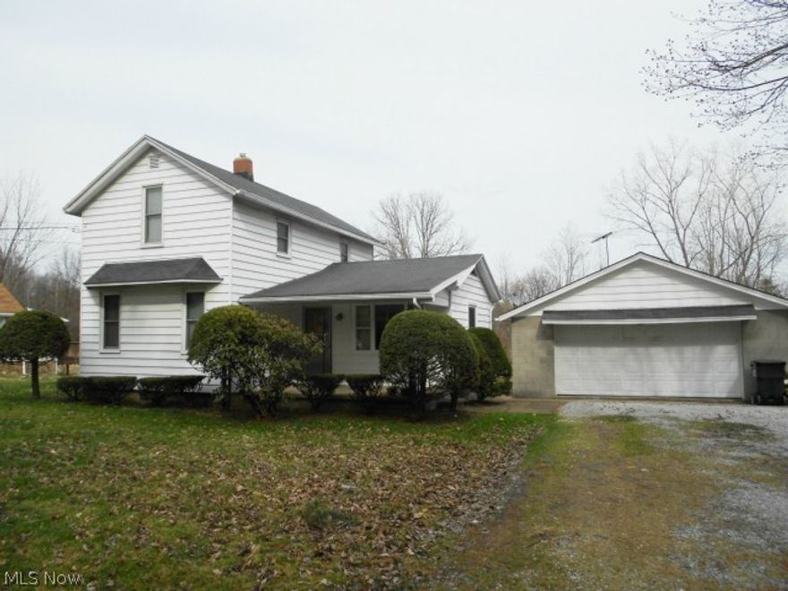If you are looking for country living, this is it!  This charming home was moved from Johnson Street in the 1960's.  Enjoy the spacious rooms and high ceilings.  Nice kitchen with ample room for table & chairs plus plenty of cabinets!  Hardwood floors under living room & dining room carpets.  Current owner uses dining room as a bedroom.  Many newer windows (most replaced in 2005), roof new in 2000, furnace new in 2009, electrical panel replaced in 2002, septic tank emptied in 2012, basement sump pump new in 2013.  Heated two car garage. Storage shed, plenty of yard for gardening.  Home warranty offered.