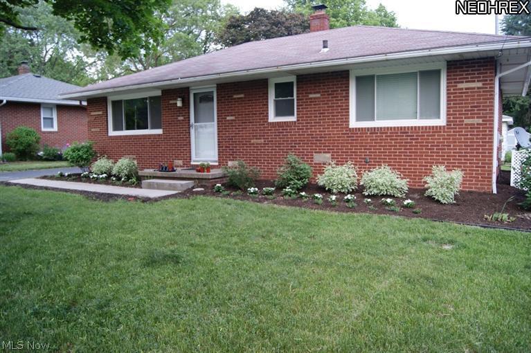 Sharp Brick Ranch in desirable Stow neighborhood in excellent condition! Living rm with large picture window welcoming the sunlight and hardwood floors that continue into the 3 bedrooms, Full Bath beautifully updated. Bright updated kitchen with ample cabinets, new floor, stainless appliances and dining area. Lower level nicely finished rec room and an office all with new carpet and an updated 1/2 bath. Newer windows & doors, electric panel, water heater, added insulation and freshly painted. Plus a 2 car garage,deep drivway with extra parking space, a shed and a beautiful large backyard.