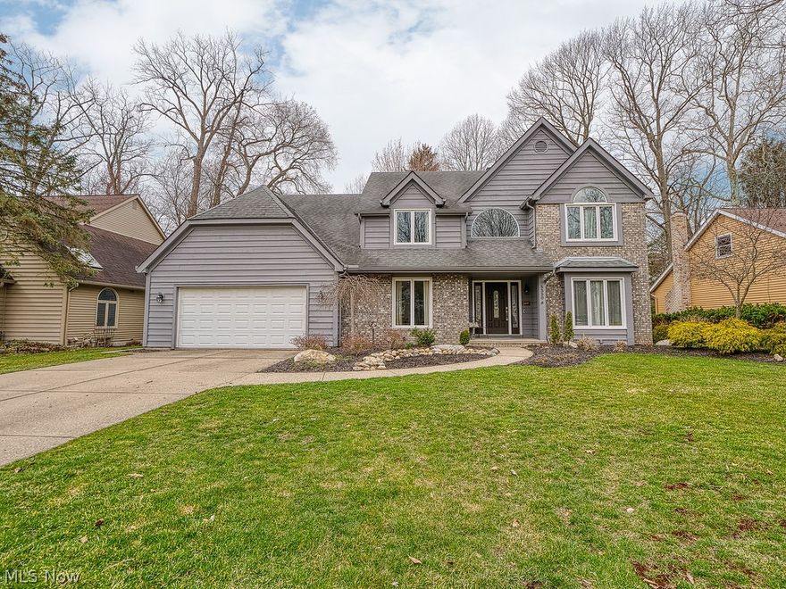 This is the home you've been waiting for!  As you walk up and notice the beautifully landscaped yard, you will fall in love with this spacious and updated colonial that greets you with an open foyer. The cozy hardwood-floored sitting room off the foyer leads to the dining room, which also includes a hardwood floor.  The kitchen features custom Amish-made cabinets, granite countertops, stainless steel appliances, and an eat-in kitchen overlooking the beautiful backyard patio.  The first floor is complete with family room, gas fireplace, laundry room, garage access, an updated half-bath, and an office or den. The second floor awaits with the master bed and bath of your dreams!  It features high ceilings, his and hers walk-in closets, tons of natural light, and a fully updated master bath. A walk-in glass-doored shower, soaker tub, linen closet and double vanity with granite countertop and ample storage complete the master bath. The second floor also includes three additional very good-si