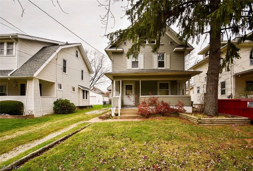 Tons of potential in this four bedroom, two full bathroom, home in Firestone Park! Nicely updated kitchen includes granite counters and has the kitchen storage you've been looking for! First floor laundry hook ups in kitchen, or you can convert the cabinet into a large pantry. There's three bedrooms and a full bath on the second floor, and the fourth bedroom is in the large finished attic. Being sold as-is.