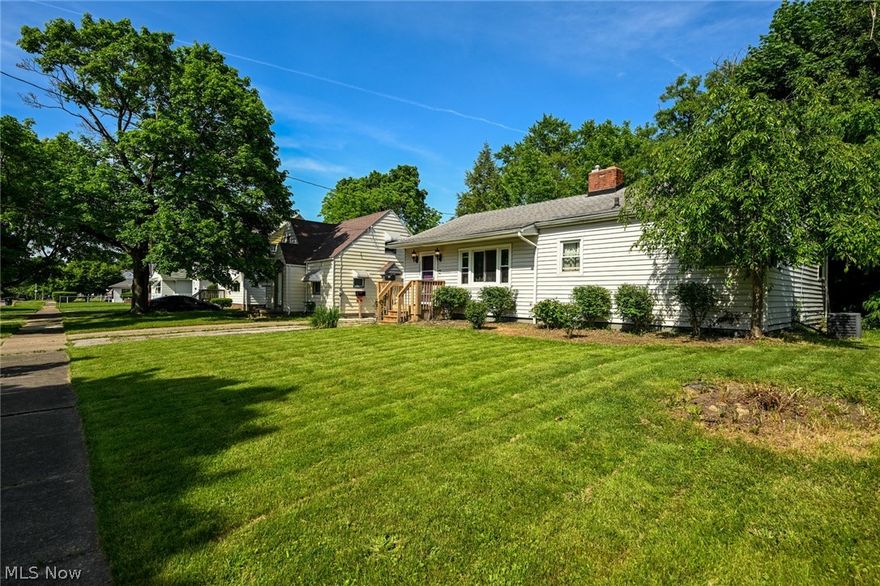 This great Akron ranch is now available!  The ultimate in affordability and 100% move in ready!  Sitting on 2 lots, this charming home features amazing green space and fenced in back yard.  Home was fully renovated in 2017.  Including bathroom, kitchen, furnace, a/c, electric service, front porch, windows and entry doors.  Garage is estimated to only be around 9 years old and roof approximately 8-9 years old.  There are original hardwood floors through the living room, hall and bedrooms.  Beautiful tile covers the floor and surround in the spacious bathroom.  There are 2 dining area options- at the right side of the open living room and at the back of the kitchen.  The wide open basement is an amazing space perfect to be finished into a family/rec room, man cave or endless storage.  Outside we have a covered back porch along with a hot tub deck!  This gem is going to go fast!  Be sure to stop by our OPEN HOUSE SUNDAY 2:00 - 3:30!!