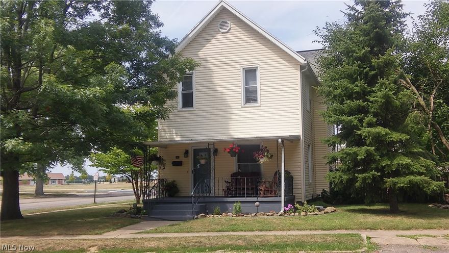 This 3 bedroom home has great curb appeal. It is a corner lot within easy walking distance to the school. You will enjoy relaxing on the shaded front porch or in the back sun porch that overlooks the back yard with privacy fence, paver patio, fire pit and a play set for the children. Large detached two-car garage. Basement could be finished for additional living space and is plumbed in for a second bath. Front entrance has foyer area leading into the dining room or living room. The bedrooms are good size with plenty of closet space. Updates include some light fixtures, landscaping, newer kitchen flooring and dishwasher. New roof to be installed over garage and home.
