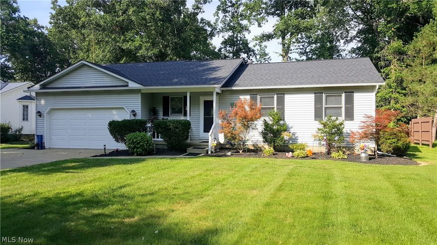 Nothing to do but move right into this beautifully well-maintained 3 bedroom Ranch that boasts laminate floors throughout and has that open floor plan you've been looking for!!  This home features a full basement with laundry. Put your finishing touches on the lower level and you have doubled your living space! The Master bedroom includes private bath.  There's a front porch and a generous sized deck out back for you to enjoy that was just recently stained with DeckOver.  Great yard with kids play-set, that will remain. All kitchen appliances along with washer and dryer included.   Roof, Garage door, patio door - all replaced within the last 10 years.   1 Year Home Warranty also included.