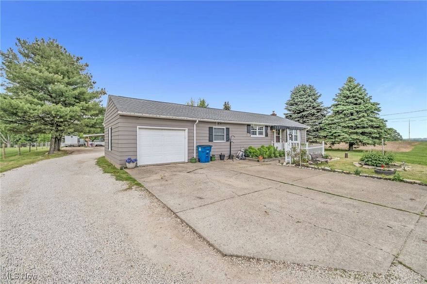 Excellent Louisville Ranch Home with Luxury Outbuilding in a beautiful Country Setting! This property has a Main House and a Fully Finished Outbuilding that was completed in 2022. Expensive Updates to the Main House include a New Samsung Refrigerator in 2024, New 220 Electric Panel in 2023, New Water Softener in 2021, New Roof and Basement Waterproofing in 2019, New Sump Pump in 2018 and a Radon Mitigation System in 2015. The Main House is One-Level Living with 2 Bedrooms, 1 Full Bath, a large Dining Area, Kitchen, Living Room and attached 1 Car Garage. The Luxury Outbuilding Exterior has 2-Inch Foam Insulation, Stucco, and Brick Veneer. Expensive features for the Outbuilding include Heated Tile Flooring in the Entry Foyer, Main Level Full Bath and Primary Bath, 220 Electric, Recessed Lighting, New Flooring and Cabinetry in 2022. The Living Area has a Stone Wall Wood Burning Fireplace that can heat the main area and High-End Laminate Flooring. Upstairs is a room functioning as a Primary Suite with a Walk-In Closet and Primary Bath with Stone Counters, a Walk-In Tile Shower and Jetted Tub. There are also 2 additional bedrooms and a Finished Storage Space upstairs. The Outbuilding also features a 38’x20’ Workshop/Garage, a 30’x12’ Storage Space and an Oversized Sauna with Fireplace. There are 3 additional Carport Parking Spaces, a Patio Area and a Large Garden. This property is zoned for single-family only and is not approved for multi-family! Please call today to hear about additional features!