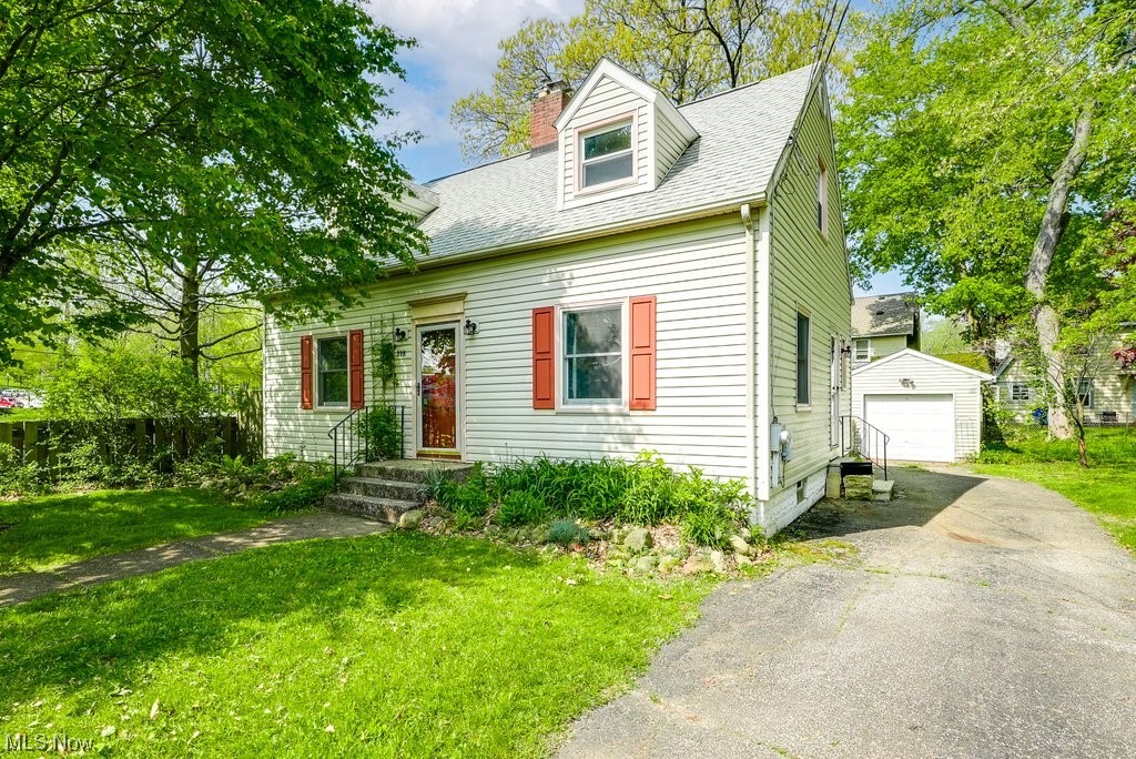 Great Kent location! This charming 3BD/1.5BA Cape is directly across the street from Kent State and just minutes from downtown Kent with easy access to shopping, dining, and entertainment. Step inside this lovely home and you'll immediately notice the gorgeous original hardwood floors throughout, neutral paint colors, and plentiful windows that create a warm and inviting atmosphere. Many original details remain including charming built-in shelving in the dining room and bedrooms, plus the living room features a cozy wood-burning fireplace insert. Off the kitchen is a convenient first floor bath - perfect for guests. The updated main bath also features a luxurious jet tub. Relax and unwind on the enclosed patio overlooking the private and fully fenced back yard! BONUS - there's an extra parcel of land next door that is included in the sale to use as you wish or possibly sell later to someone looking to build. You won't have to worry about expensive repairs anytime soon as many of the bi