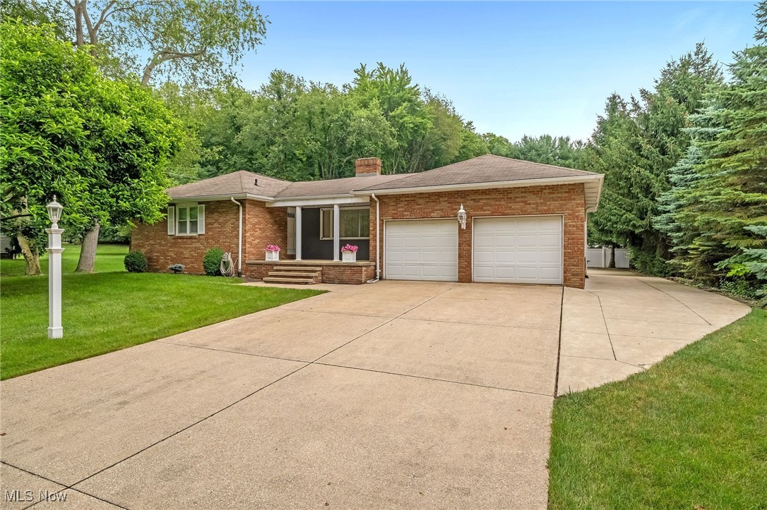 Welcome to your dream home nestled in the tranquil Carlew Estates! This unique property, owned by the same family since it was constructed, is a rare find! A solid brick ranch with the charm of wooden board and batten siding accents, exudes both character and warmth. With an impressive 3,283 sq ft of livable space, this meticulously maintained home provides a perfect balance of comfort and functionality. Step inside to discover a bright and airy floor plan featuring three spacious bedrooms on the main level, each filled with natural light and thoughtfully designed. Check out the master and ensuite! The inviting kitchen, showcases beautiful stained wood cabinetry, a hand-crafted glossy tile backsplash, and newer appliances. A cozy wood-burning fireplace, featuring an elegant oak mantle, adds an inviting touch, while a convenient wet bar with wine storage elevates your entertaining game. Flow seamlessly into the family room, featuring a gas fireplace with custom wood mantle and a flush tile hearth. The living room features a half wall that creates a sense of openness while maintaining its cozy atmosphere, making it an ideal gathering space. Venture downstairs to the expansive finished basement featuring three grand-sized bedrooms, this area adapts perfectly to your needs—be it a playroom, office, or guest quarters. Step outside to revel in the amazing outdoor features that this property offers. A massive 30 x 40 heated pole barn/garage ensures ample parking, storage, or hobbies. The covered side patio, with stylish wood-look porcelain plank tile, is an ideal spot for unwinding. Practicality meets luxury with a reverse osmosis water system, and recent updates like new carpet in all bedrooms and new water heater. Enjoy the added benefits of high-performing Jackson Schools and a peaceful neighborhood that feels like home. Come and experience the perfect blend of elegance, functionality, and charm in a wonderful location!