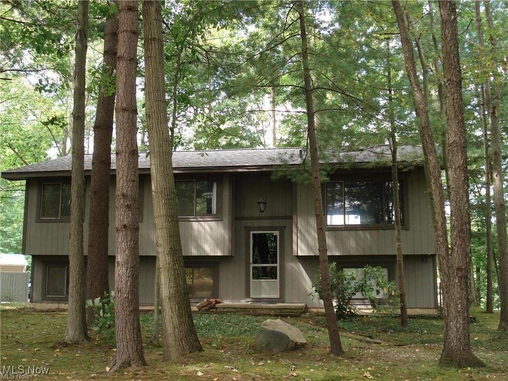 Lake front home with a private setting! This remodel and upgraded home features 6 bedrooms and 2 baths with breath taking views of the lake and park like setting. One of the largest lots on the lake, approx. 1 acre of land and approx. 330 foot of lake frontage. Upper deck and patio below for entertaining, and newer steps down to the lake and private deck. Upgrades include, roof/gutters/downspouts/exterior paint 2yrs, kitchen, kitchen island, flooring, lighting, and bedrooms. Huge kitchen and living room, with plenty of storage and bedrooms for guests. So much to see!