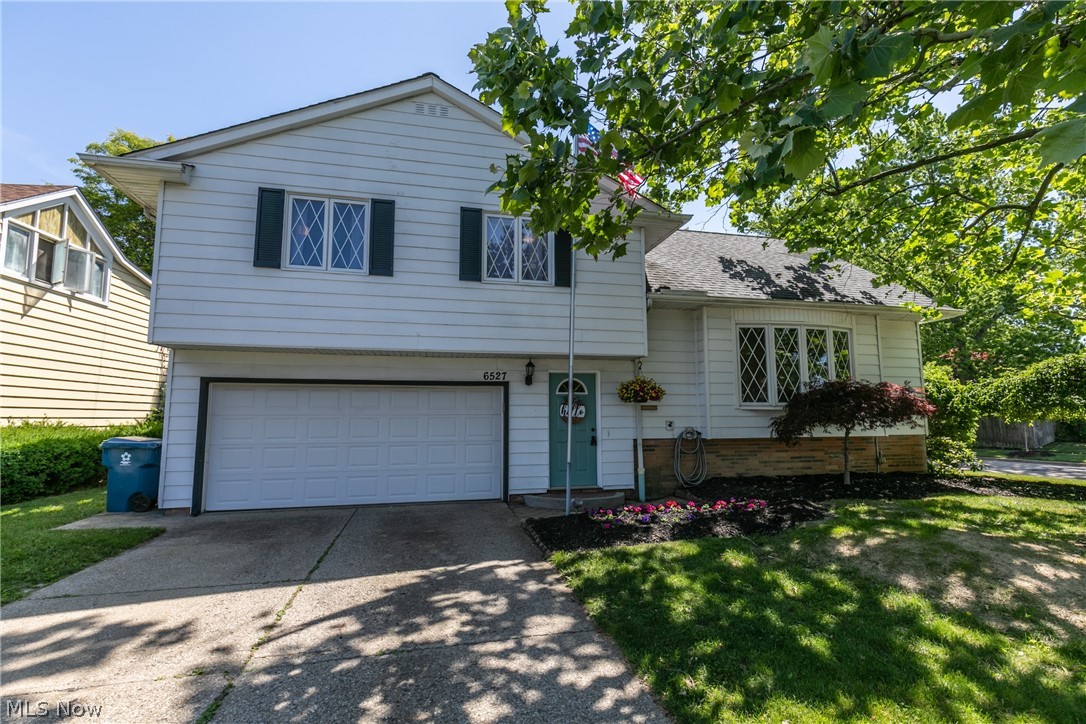 Great 4 bedroom, 2.5 bath Split Level nestled in the heart of Parma Heights! Charming exterior with nice flower beds. Inside the foyer leads to a convenient 1/2 bath & up to the large living room with hardwood floors that flow into the bright dining room. The spacious kitchen is complete with ample cabinetry & prep space, tile flooring, backsplash & included appliances. Upstairs are 3 comfortable bedrooms all with wood floors & 2 full updated baths; showcasing the master suite w/ private bath. Another level provides a 4th bedroom also with wood floors. More living space is found in the finished basement with sprawling recreation room w/ fireplace, plenty of storage space & laundry areas with washer & dryer. You will love spending time outside on the amazing deck w/ built-in seating & fenced in yard w/ storage shed! Welcome Home!