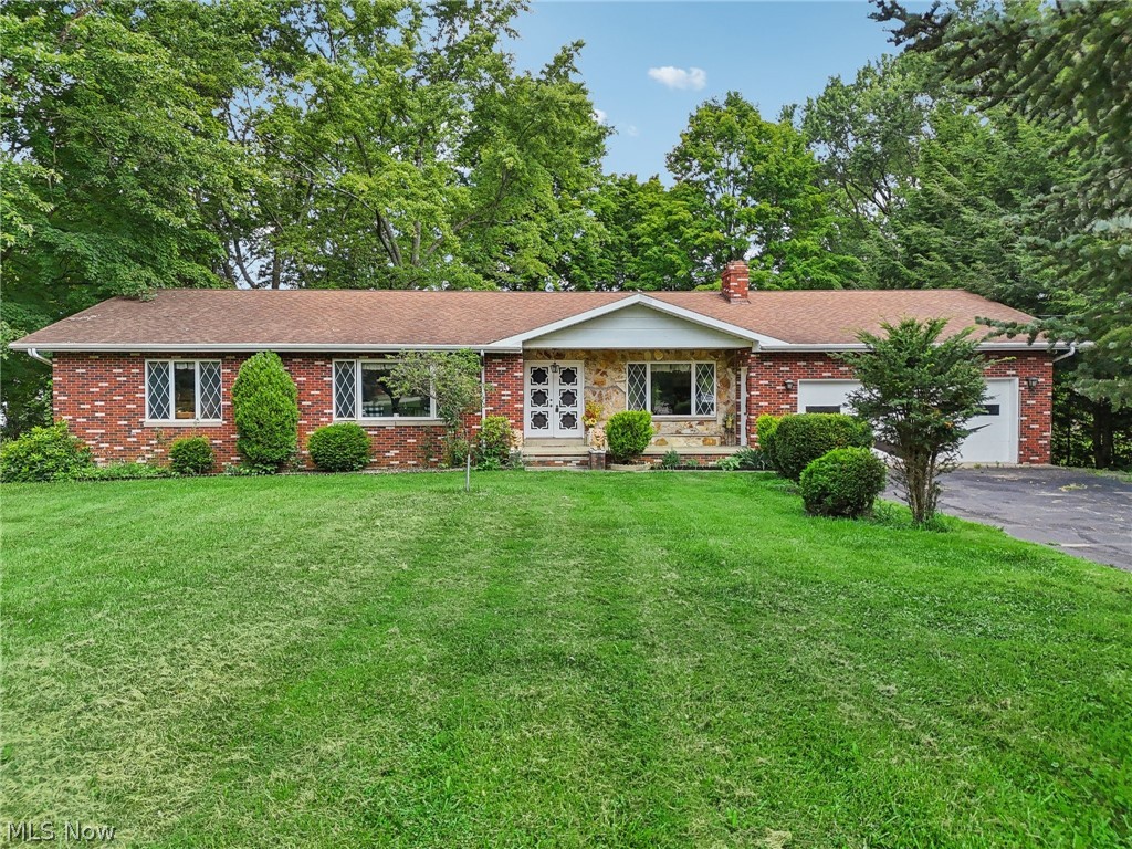 Possibilities are endless in this spacious 4 bedroom, 4 full bath home on over an acre. The main level has no shortage of living space including an eat-in kitchen, living room, dining room, family room, and home office. There are also 4 bedrooms and 3 full baths on the main floor. The walk-out lower level can be used as a mother in law suite and has its own kitchen, dining area, living room and full bath. The back yard is peaceful and serene with lots of trees and beautiful pond. The joys of country living combined with the convenience of being minutes from Route 11, shopping and more.