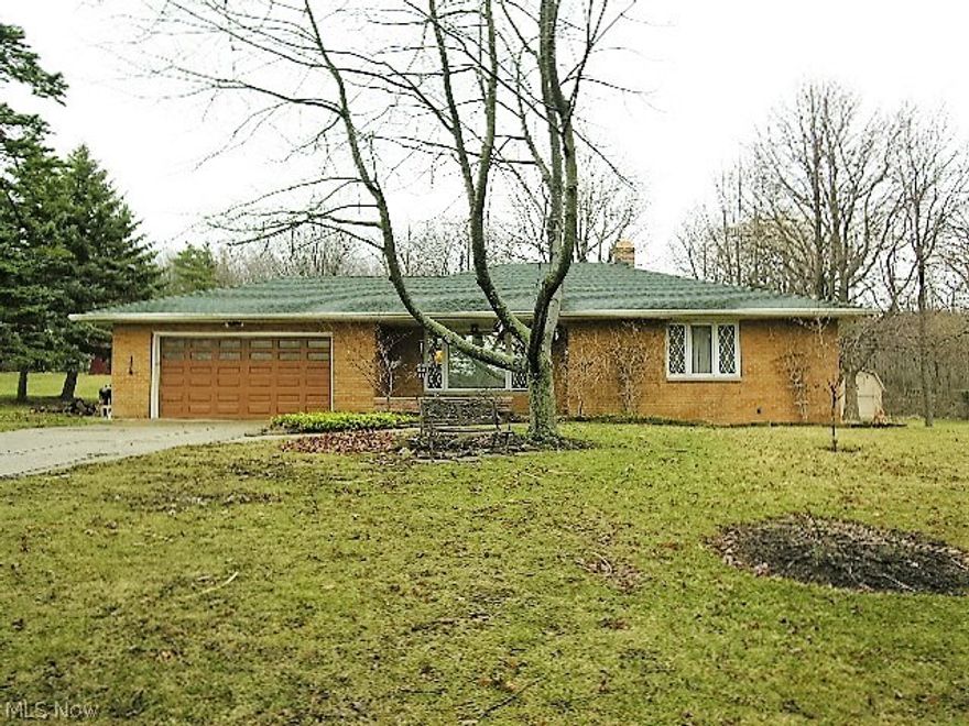 Solid and Updated Brick Ranch with Attached 2 ½ car Garage + 16x20 Outbuilding! 3 bedrooms, 2 Full Baths, Large Open Living Room, Large Updated Kitchen and Awesome Finished Recreation Room! Kitchen with Cabinets Galore, Newer Counter Tops, Ceramic Floor, Jen Air Convection Oven, Convection Microwave, 8 Month Stainless Dishwasher  + Separate Eating Area! Hardwood Floors Under Carpet in Living Room and Bedrooms! Huge Finished Recreation Room with Ceramic Tile Floor, Awesome Wet Bar with Mini refrigerator! Ceramic Tile Laundry Room plus Full Bath with Shower! Separate Workshop Area! 100x320 Lot with Private Back Yard!2 ½ car Attached Garage with newer insulated garage door + Man Door to Back Yard! 16x20 2-Story Brick/Block/Wood Truss Out Building with 8 ft. Overhang (built in 1976)! Many updates include Roof, Gutter Guard, Central Air, HWT, Pella Windows, Glass Block Windows, Paint, Recreation room + Much More! Attic storage! Call to See Today!