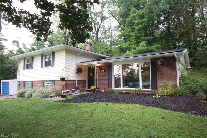 Welcome to the wonderfully open updated split level home nestled against the woods in the back yard.  The home was updated approximately 3 years ago.  The main floor features beautiful laminate floors.  The kitchen has newer cabinets granite counter tops as well as all stainless-steel appliances including a gas stove.  Upstairs are 4 wonderful sized bedrooms with a master bedroom that is large enough for your furniture and its own bath.  Most of the rooms throughout the home have recently been painted. The house sits back from the street allowing for a large front yard and back yard with a private patio that is terraced up into the woods.  There is also a fire ring for nighttime gathering on the terrace. The home is in the highly acclaimed Nordonia school system, very convenient to Cuyahoga County Metro parks, Cuyahoga Valley National park, as well as the Summit County Metro parks.  There is also easy access to the major highways of northeast Ohio.  Do not miss out, make your appointme