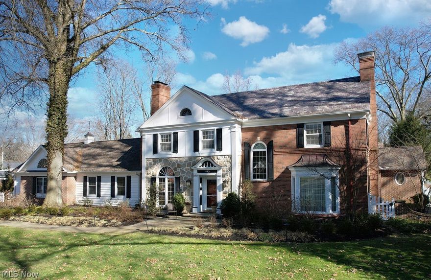 This property is an Akron dream thanks to classic design & a beautifully updated floorplan, on one of the city's most desirable streets. An exterior with mature trees, curved drive & tremendous curb appeal beckons you in. In the foyer, you’ll find attractive hardwood floors that run throughout much of the home. The formal living & dining rooms are spacious & the large windows bring in tons of natural light. The kitchen is vast with custom cabinetry, island for prep and seating, plus eat in area for casual gatherings or weeknight meals. Flow to the Great Room with vaulted wood clad beamed ceilings & 1 of 4 fireplaces you can cozy up to. Be charmed by the sunroom and pristine private yard lined with lush trees, situated on almost an acre. Stone patios, courtyard & storage shed are features not to be missed. The first floor Primary Suite is a retreat of its own with vaulted ceilings, picture windows, large private bath and walk in closet. Main level has a powder room, laundry, mud room ar