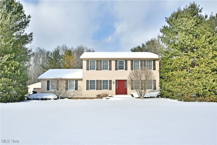 If refined space, privacy, and natural beauty are at the top of your list this exceptional Champion estate delivers on every level. Offering three full floors of beautifully finished, move-in-ready living space, this expansive 3-bedroom home showcases timeless design throughout and is set on 14+ scenic acres. The setting is just as impressive as the home itself. A picturesque pond enhances the professionally landscaped grounds, creating a peaceful backdrop for everyday living while offering a rare opportunity for recreation, expansion, or a private retreat immersed in nature. Car enthusiasts, hobbyists, and those needing extra storage will appreciate the attached 2-car garage along with a substantial 48'x28' detached garage featuring 12ft ceilings, concrete floors, and a wood-burning stove. Outdoor living space shines with a tiered deck, stone-accented landscaping, and a spacious patio ready to enjoy as the seasons change. Inside, the welcoming foyer leads to a graceful staircase. The elegant dining room features stepped ceilings, tasteful lighting, and hardwood-like flooring that flows seamlessly into the heart of the home. The main living room invites relaxation with plush carpet and a stone-trimmed fireplace that serves as a warm focal point. The beautifully updated kitchen is both stylish and functional, offering ample cabinetry, stunning granite countertops, and a generous pantry. Just beyond, the cedar-lined 4-season room provides a serene, sunlit escape perfect for year-round enjoyment. Upstairs, the prominent master bedroom serves as a private retreat complete with a walk-in closet and a spa-inspired bath featuring a custom tiled shower w/ multiple spray heads. A 2nd remodeled full bath sits mid-hall, along w/ a conveniently tucked-away 2nd floor laundry area. Two additional bedrooms are nicely sized and offer walk-in closets. The finished basement adds even more space with a bonus area and a rec room complete with a bar area that's perfect for entertaining.