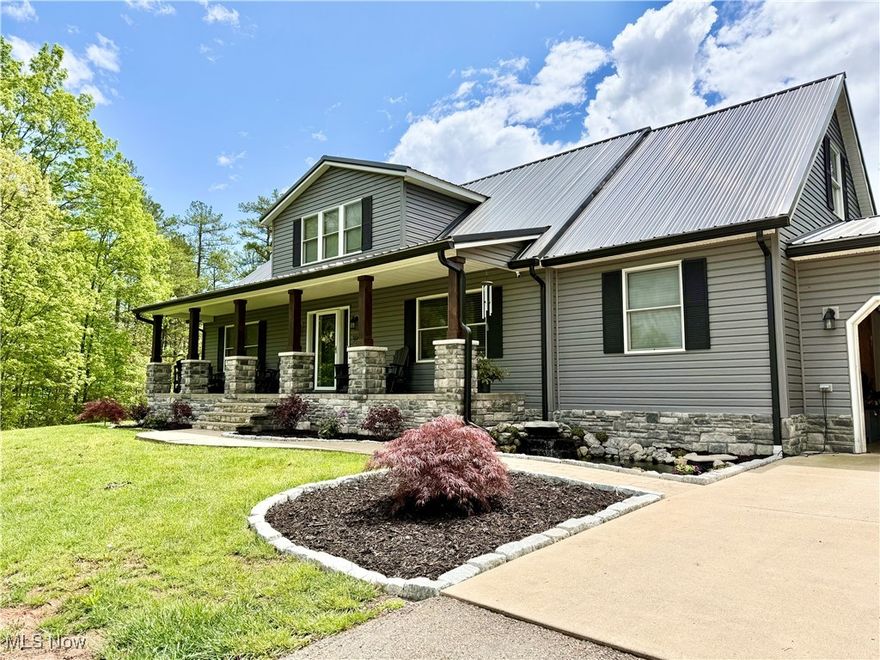 Ideally located 5 mins from schools, 10 mins from Holzer Gallipolis/US-35, and 30 mins to NUCOR WV. This estate offers the perfect blend of convenience and seclusion, sitting directly across from the 80+ acre ODNR Samuels Wildlife Area. Nestled on 4+ acres of timber, the 4BR/3BA home is a private sanctuary. The open interior features a chef's kitchen with granite, stainless appliances, and a large island. The main floor boasts fresh paint, an owner's suite, plus a secondary bedroom and bath. The 2nd floor offers a second living area, two bedrooms, and a full bath. Outside, new 2024 stonework wraps the porch, home base, and cedar columns for striking curb appeal. The backyard is a 2024 oasis with a 27' above-ground pool, gazebo, fish ponds, and fresh landscaping. Practical upgrades: 24kw Generac generator, 6" black gutters, paved drive, and 22x35 concrete patio. The insulated 24x24 garage includes a pellet stove and large door, plus a 16x12 outbuilding. The massive poured-wall basement with tall ceilings is ready for expansion. Home was stick-built to BOCA code in a controlled environment and assembled onsite. OPEN HOUSE 2/10 4PM-6PM