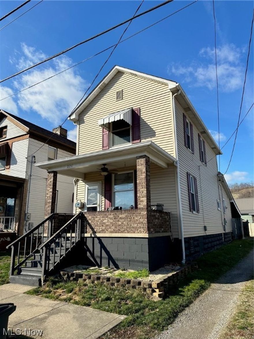 Enjoy this 2 bedroom, 2 story home with formal living and dining rooms.  Remodeled kitchen, bathrooms, and laundry room.  Freshly painted with newer flooring throughout.  Large carport of back of home and concrete patio.  Walking distance to amenities.  Enjoy this one soon!