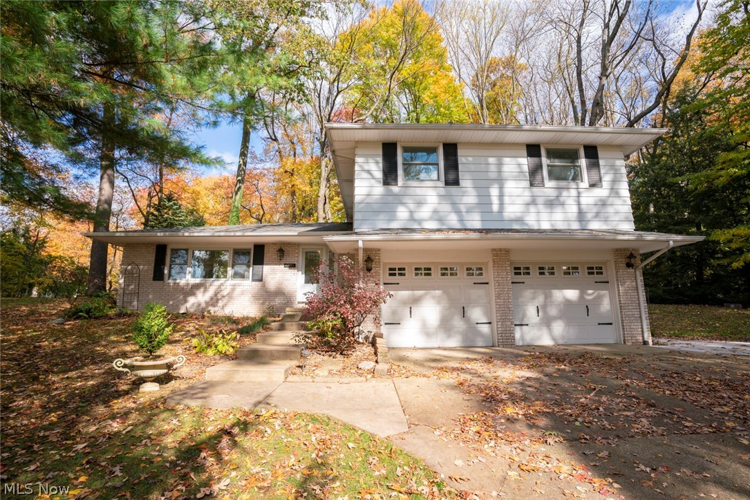 Welcome to this gorgeous 5-level-split-home in Jackson Township! Walk-in through the front door, and you will be overwhelmed by the open concept & beautiful kitchen. Completely renovated in 2019 w/new cabinets, ceramic farmhouse sink & appliances! The stunning mosaic tiled backsplash is accompanied with floating shelves. The spacious island allows for additional storage & seating. There's even a passthrough that connects the cedar-lined four season rm to the kitchen. The sunroom provides extra living space with natural light and a new ceramic floor. Engineered hardwood flooring throughout the main & lower level. Fresh paint throughout! Living rm connects to the kitchen which makes it great for entertaining! Heading down just a few stairs, you'll find an add'l living space (now being used as the formal dining rm) w/access to the stone patio. The patio has great space for grilling out! Stone stairs lead you up to the rest of the backyard with a gas fireplace. The laundry rm & half bath c