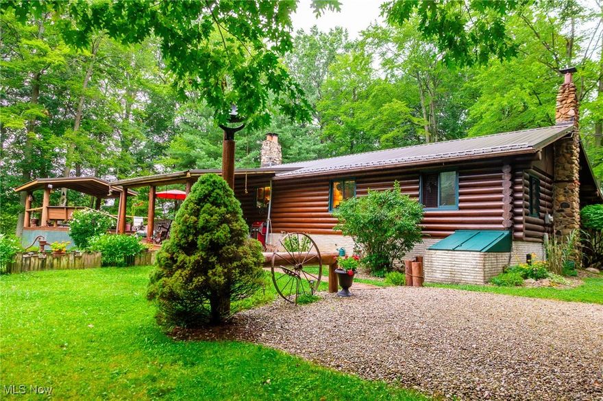 Discover the charm of country living with this beautiful log home nestled on 7.6 wooded acres in Ashland County. The 1,536 S.F. log home features a spacious open-concept main room where the kitchen, dining, and living areas come together with cathedral ceilings and a large fireplace centerpiece. The home features 3 bedrooms and 2 full bathrooms on the main floor, with a basement offering laundry, extra living space, an additional fireplace, and plenty of storage. Utilities include a fuel oil forced air furnace, as well as a Newmac wood burning furnace, propane hot water heater. Enjoy outdoor living on the covered front deck or the expansive back deck featuring a hot tub under a canopy—perfect for entertaining or relaxing. Outbuildings include a 20 x 30 detached garage, as well as a character-filled 26 x 38 barn with a concrete floor, original barn beams, and two horse stalls and water—ideal for hobby farming, storage, or workshop use. With abundant woods, open fields, and a home that blends rustic warmth with modern convenience, this property is a rare find ready for its next chapter. Additional 2.2 acre parcel available for purchase.