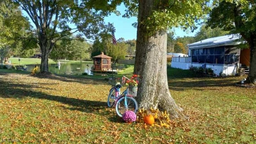 Beautiful home awaits near Seneca lake! Enjoy the outdoors with this delightful property featuring a pond! Well-Kept manufactured home with two bedrooms and two baths, modern kitchen with adjoining dining room opening into a screened porch and on out onto a large deck overlooking pond! Home also has a family room with gas fireplace, two storage shed, two car detached garage and nice concrete driveway! New Air Conditioning and Dishwasher in March 2025!
