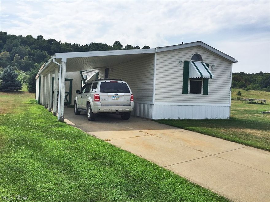 Welcome to Woodale Village! This 3 bedroom, 2 bath home has lots of character!  Oak cabinets in kitchen, new carpet throughout and new laminate in bathrooms.  Extremely Clean!  Very low taxes.  Quiet and well maintained community.  Call today!