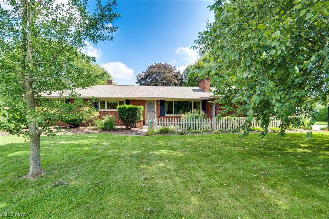 Welcome to this charming all brick ranch home that exudes both warmth and character. This adorable residence boasts a unique floorplan that sets it apart. With 3 bedrooms and a total of 2,111 square feet, this home provides ample room for all your needs. Upon entering, you'll be captivated by the thoughtful layout and design. The updated kitchen features beautiful cabinetry, center island, and is open to the dining area. The family room, conveniently located off the kitchen opens to the screened patio that overlooks the back yard and just beyond the screened patio, a deck awaits. The large master bedroom is a true retreat, featuring not only a cozy sitting room that doubles as a home office or nursery, but also the convenience of an en-suite bath and laundry. A door from the master bedroom leads you outside to a small private sitting area, where you can unwind while enjoying the tranquility of the back yard. The living room is the heart of comfort, boasting a charming brick fireplace w
