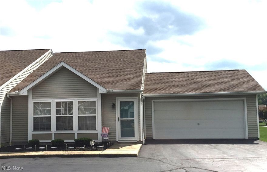 Don't miss out on this beautifully updated condo featuring newer flooring, newer kitchen and bath cabinets and countertops, cathedral ceilings, loft overlooking the living room and fireplace, private patio, 2 car attached garage and much more! This condo is an end unit and is situated on the outskirts of the development with a wooded setting. Call for your private showing today!