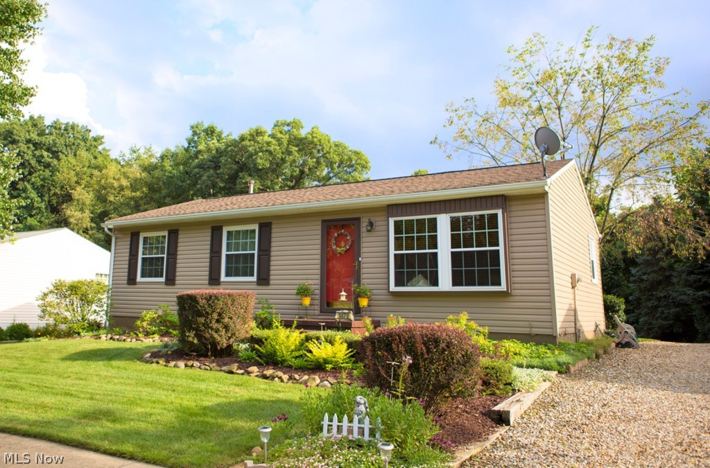 Three bedroom ranch completely updated in a peaceful setting. Home features outdoor fountain, comfortable and open floor plan, newer fixtures, and a finished basement with a bonus area for an office or sitting room. The fully applianced kitchen offers plenty of cabinets & a breakfast bar. Bedrooms are large and offer good sized closets and ample space to unwind. Enjoy the wood deck in the private backyard. 2.5 car garage & home warranty included. Updates include new siding ('12), new roof ('12), new shutters and downspouts ('12), new carpet, new flooring, remodeled bathroom on main floor. Move right into this beautiful home. Call today for a private showing.