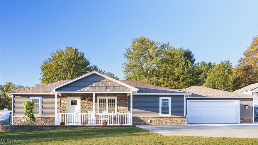 A gorgeous renovated ranch on nearly an acre! This beautifully renovated three-bedroom vinyl ranch offers the perfect balance of modern updates and everyday convenience. Step inside to find an updated kitchen featuring stainless steel appliances, Corian countertops, Merrillat Hickory cabinets, and a free-standing work island with electric service. A cozy eating area makes the kitchen the true heart of the home. The living room and all three bedrooms feature brand-new LVT flooring, while both full baths have been fully remodeled with ceramic tile, double sinks, and updated fixtures. A mudroom and an enclosed breezeway add function and charm,  covered front porch extend your living space outdoors and concrete patio looking at the beautiful backyard Updates & Features: Brand-new windows, roof, HVAC, electric service, paint, and lighting fixtures—truly move-in ready. Stainless three-door refrigerator, drop-in gas range top, built-in oven with digital display, and dishwasher. Deep split sink with pull-out faucet & easy-slide cabinetry. First-floor laundry room with washer and dryer included. Attached 572 sq ft two-car garage plus a shed for extra storage. .93-acre lot (100x435) with a new retaining wall and recent conversion to public sewer and water. Plumbing already in place for a second full bath in the primary bedroom. The property’s deep backyard makes it feel even larger than it looks, providing room for entertaining, gardening, or just relaxing in privacy. Location Bonus: Enjoy quick access to Routes 46/446, 62, 224, 11, 80, and 76, as well as the Ohio Bike Trail and nearby communities of Boardman, Austintown, Salem, and Columbiana County. If you’ve been searching for a low-maintenance vinyl ranch with nearly an acre of land and brand-new everything, this is the one you don’t want to miss!