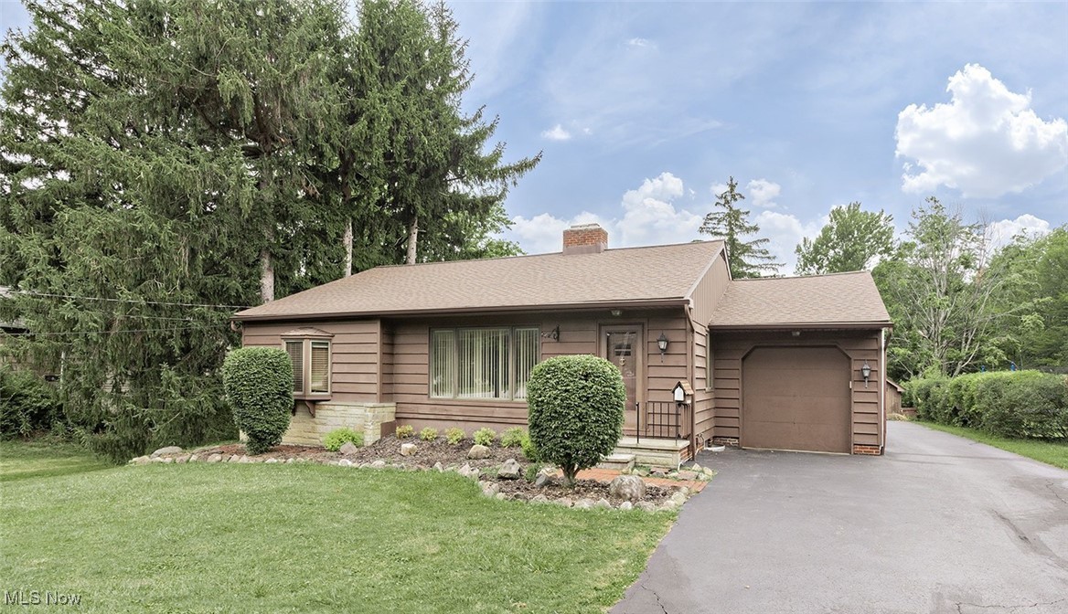 Welcome home!! Pride of ownership is the hallmark of this meticulously well-maintained 4 bedroom 3.5 bath ranch with finished lower level. This wonderful home rests on 1.5 beautiful acres - the perfect combination of lush greenspace and a park-like wooded area. So much larger than it appears, the interior boasts a wonderful footprint that will accommodate all of your family needs - whether hosting large gatherings or simply enjoying the routine of daily life, this is a great floorplan. Spacious living room with fireplace. Central kitchen (all appliances stay) that opens to a dining area/ family room with direct access through sliders to the rear deck. Formal dining room. A bonus pass through room - perfect for an office, study area or gaming space. A warm and inviting den with direct access to the 1st floor laundry room. Four nicely appointed bedrooms. The primary suite has direct access to a half bath. Two additional full bathrooms round out the 1st floor. The lower level features an enormous recreation room with bar area and fireplace, loads of storage space and a work area. Home warranty. Additional parking around the side of the garage and at the rear of the home. The rear deck is the perfect place to relax or entertain - it overlooks the fabulous backyard with 2 sheds, loads of greenspace, a lovely creek with bridge and private woods (2 parcels). This is an exceptional home, location and opportunity!!!