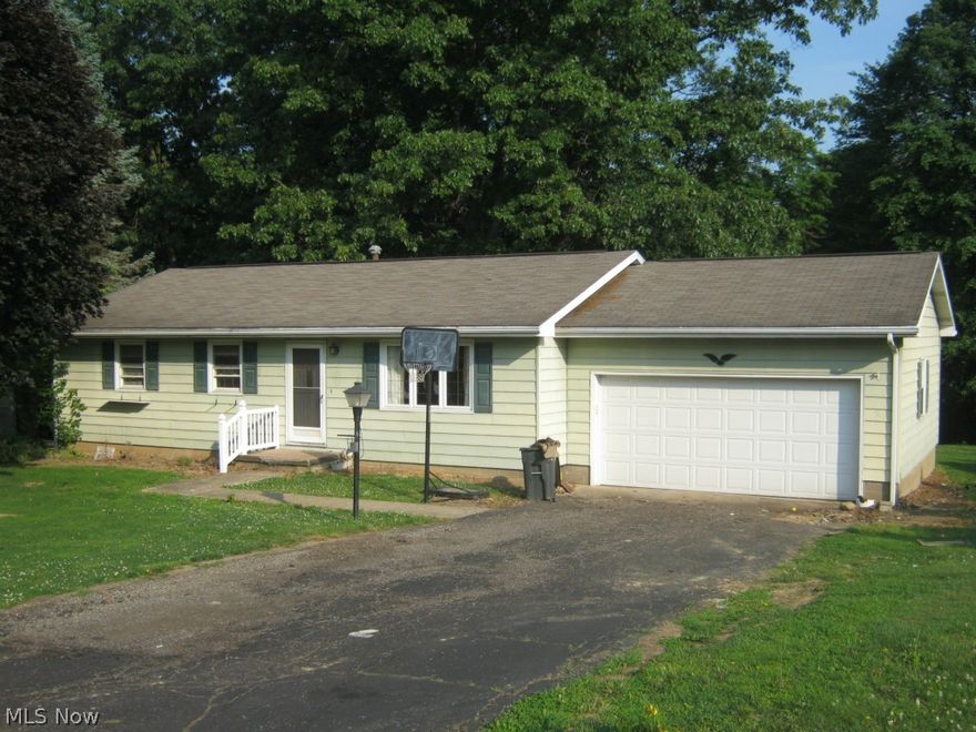 Handy East end location for this 3 bedroom, 2.5 bath ranch,   Kitchen has stainless appliances,  great back yard with trees - covered deck with benches and hot tub.   Has public water